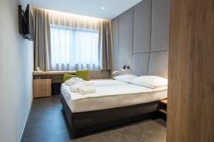 Postel nebo postele na pokoji v ubytování Hotel Zdravilisce - Thermana Lasko