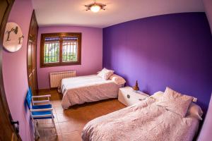 A bed or beds in a room at El Encinar