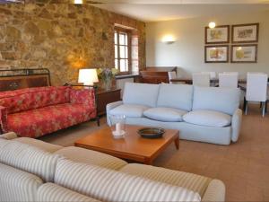 a living room with two couches and a table at Casale Umbro in Castiglione del Lago