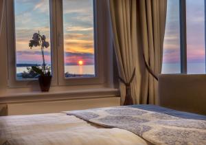 Postel nebo postele na pokoji v ubytování Hotel Am Leuchtturm