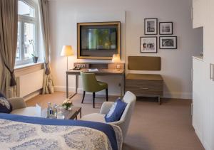 TV a/nebo společenská místnost v ubytování Hotel Am Leuchtturm
