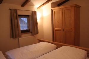 Posteľ alebo postele v izbe v ubytovaní Chalet Alte Mühle