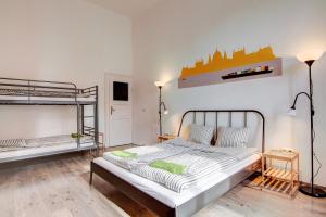 a bedroom with two bunk beds in a room at Pal's Mini Hostel in Budapest