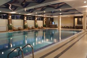 a large swimming pool in a hotel room at Spa Hotel Ata in Varshets