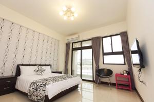 Postel nebo postele na pokoji v ubytování Rain Sun Homestay