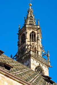 a clock tower on top of a building at Hotel Regina in Bolzano