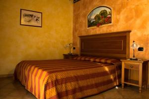 Postel nebo postele na pokoji v ubytování Agriturismo Tre Rondini