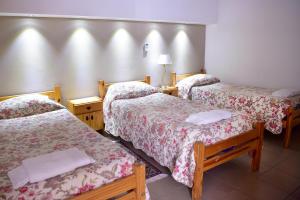Una cama o camas en una habitación de Hotel Ozieri