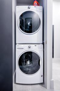 two washing machines stacked on top of each other at Les Lofts Notre-Dame - Par Les Lofts Vieux-Québec in Quebec City