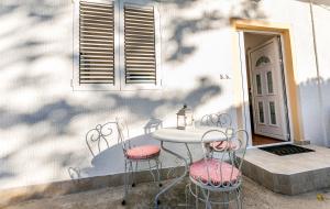 a table and chairs sitting on a patio at Apartments Batricevic in Herceg-Novi