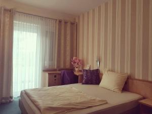 Postel nebo postele na pokoji v ubytování Hotel Ring Park