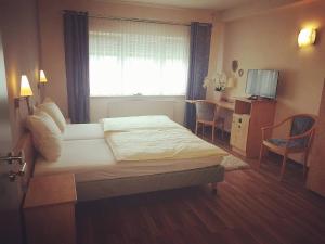Postel nebo postele na pokoji v ubytování Hotel Ring Park