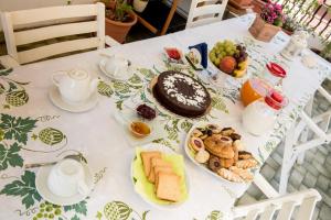 a table with a plate of food on it at La Castellese in Aci Castello