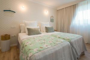 Posteľ alebo postele v izbe v ubytovaní La Concha Boutique Apartments - Adults Only
