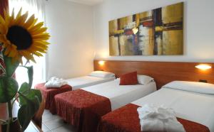 Ένα ή περισσότερα κρεβάτια σε δωμάτιο στο Hotel Scaldaferro