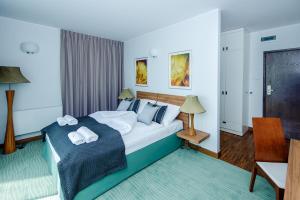 Postel nebo postele na pokoji v ubytování Hotel Active