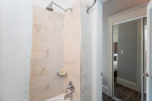 a bathroom with a shower and a sink at The Cartwright Hotel, Union Square BW Premier Collection in San Francisco