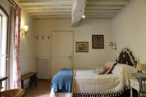 a bedroom with a bed in a room at Country Home in Tuscany in Colle Val D'Elsa