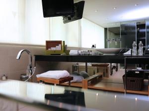 a bathroom with a sink and a counter top at Hotel Eclat Taipei in Taipei