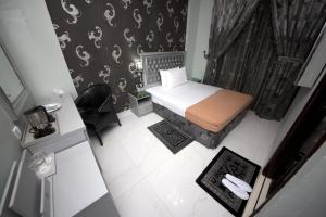 Postel nebo postele na pokoji v ubytování White Fort Hotel