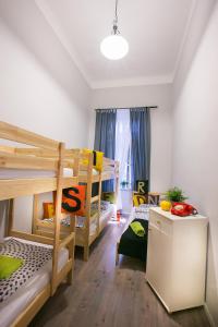 A bed or beds in a room at Friends Hostel & Apartments