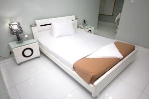 Postel nebo postele na pokoji v ubytování White Fort Hotel