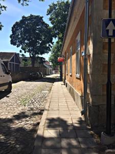 an empty street next to a brick building at Südalinna apartment in Kuressaare