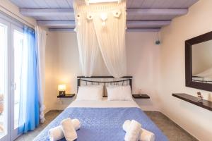 Postel nebo postele na pokoji v ubytování Verano Mykonos Villa + 38 fotografií