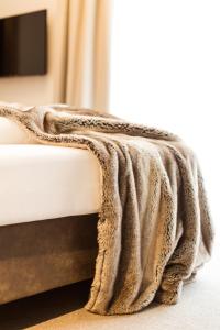 A bed or beds in a room at enjoy ischgl