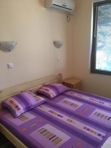 A bed or beds in a room at Apartment Martin Beach