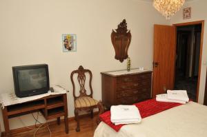 A television and/or entertainment center at GuestHouse Arcela