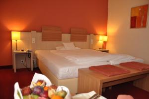 Postel nebo postele na pokoji v ubytování Hotel am Kurpark + 37 fotografií