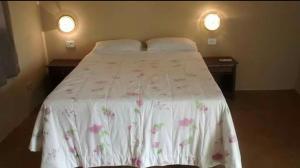 En eller flere senge i et værelse på Hotel Pintado Azul