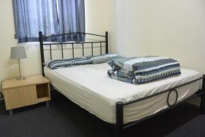 Postel nebo postele na pokoji v ubytování Elizabeth Hostel