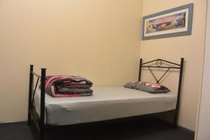 Postel nebo postele na pokoji v ubytování Elizabeth Hostel