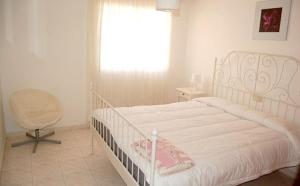 A bed or beds in a room at Casa Jasmin 1