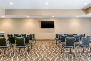 a conference room with chairs and a flat screen tv at Comfort Suites Florence - Cincinnati South in Florence +34 photos