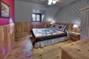 מיטה או מיטות בחדר ב-Les Chalets sur le Cap