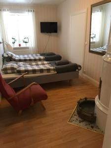 TV a/nebo společenská místnost v ubytování Skärplinge Gästis B&B