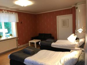 Postel nebo postele na pokoji v ubytování Skärplinge Gästis B&B