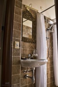 a bathroom with a sink and a mirror at Los Flamingos in La Maddalena +42 photos