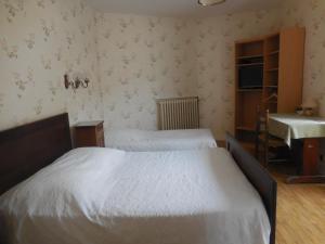 Postel nebo postele na pokoji v ubytování Hotel Magne