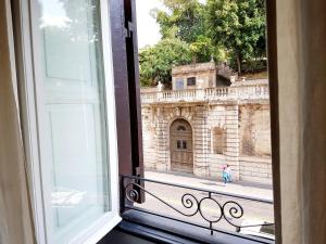 an open window with a view of a building at Sweet Dreams Roma in Rome