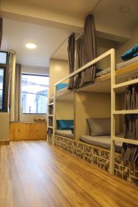 Postel nebo postele na pokoji v ubytování DaLat Sky Hostel