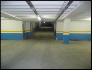 an empty room with blue and yellow stripes on the walls at Sol Tarter in El Tarter