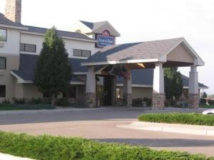 a building with a gazebo in front of it at AmericInn by Wyndham Windsor Ft. Collins in Fort Collins