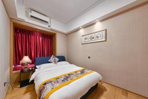 Heefun International Apartment - Zhujiang New Town FuLi Brand New World Plaza客房内的一张或多张床位