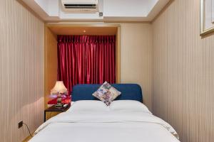 Heefun International Apartment - Zhujiang New Town FuLi Brand New World Plaza客房内的一张或多张床位