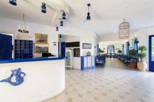 a very nice looking kitchen with a lot of windows at Atheras in Evdilos
