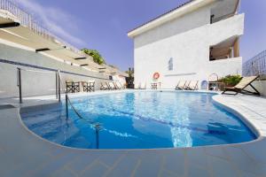 a large swimming pool in the middle of a building at Atheras in Evdilos